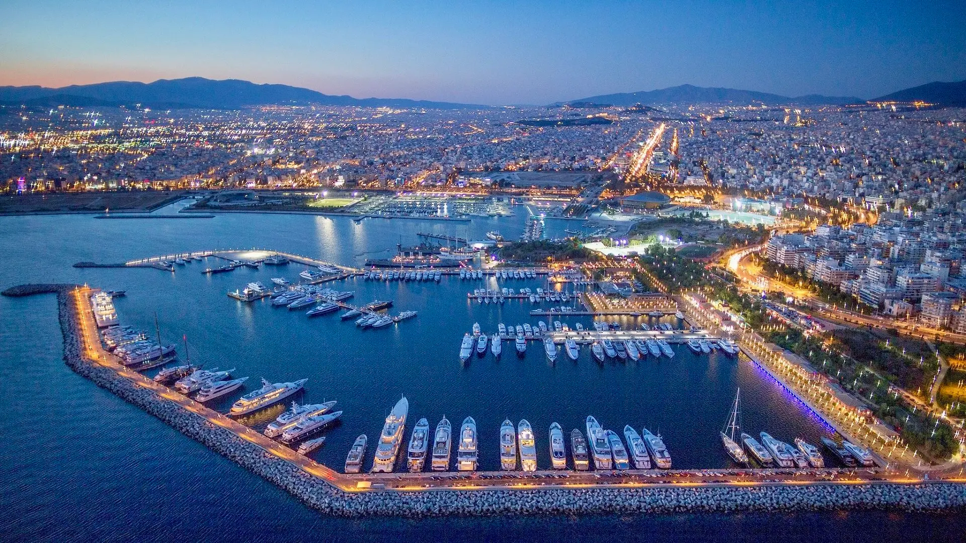 Athens riviera. A modern coast area with many boats and a roadway stretching out .