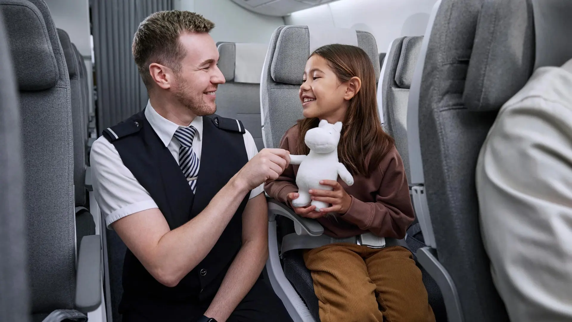 finnair host entertaining a young girl