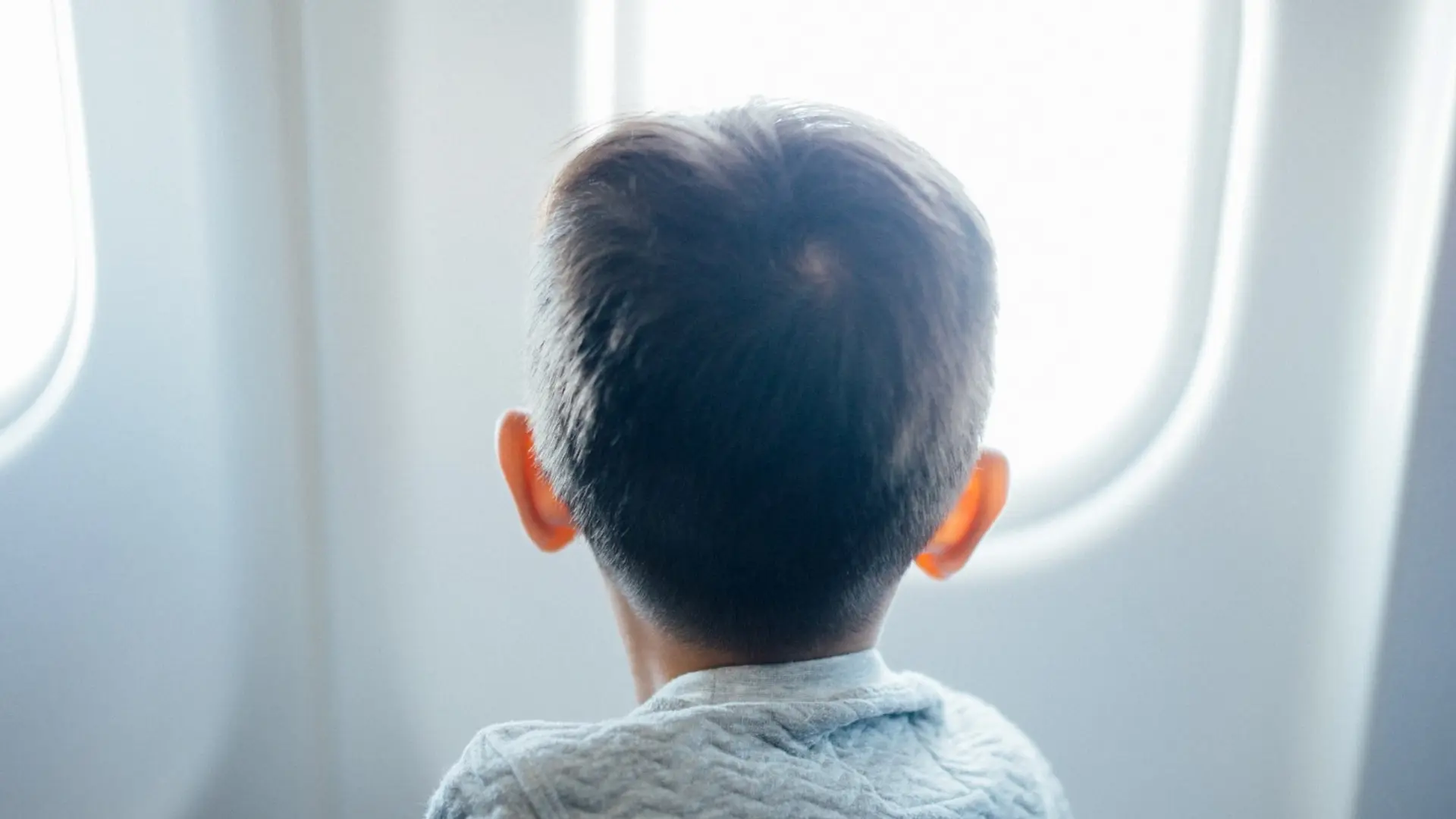 a young boy in business class