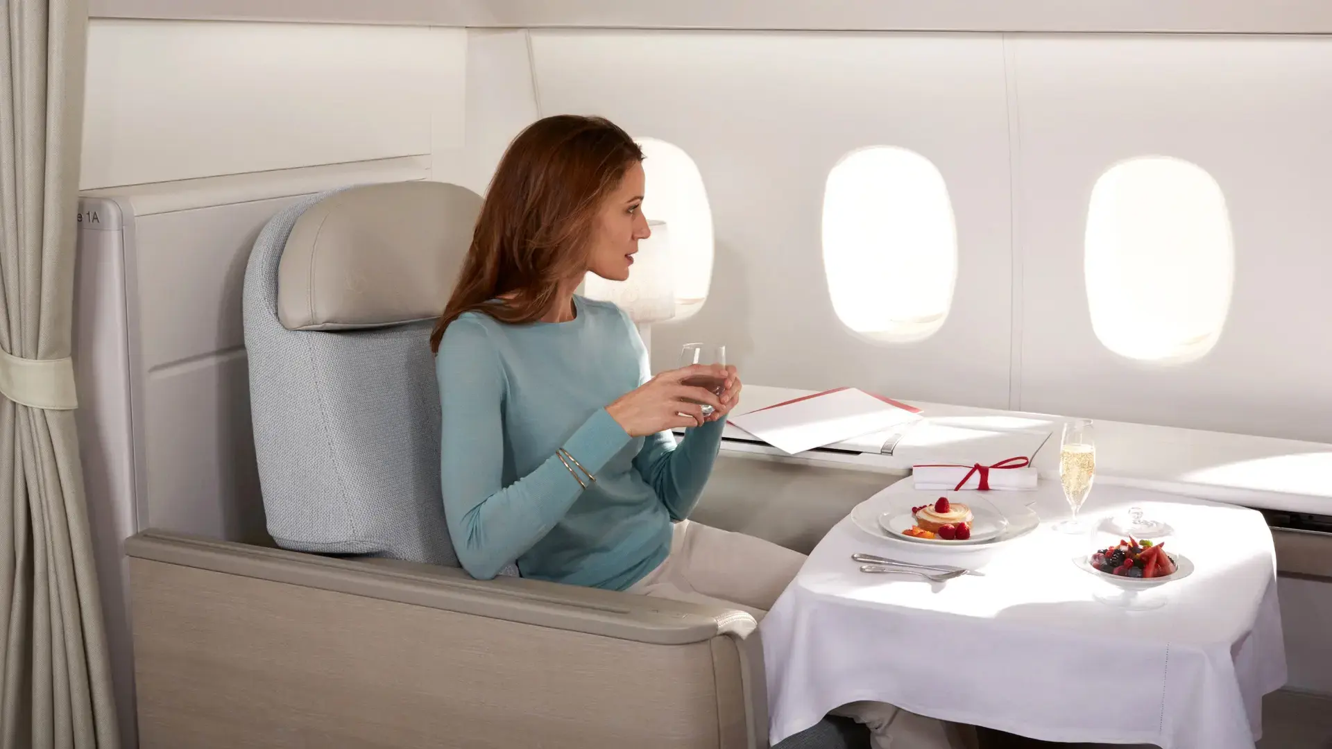 Woman enjoying Première Dining in first class