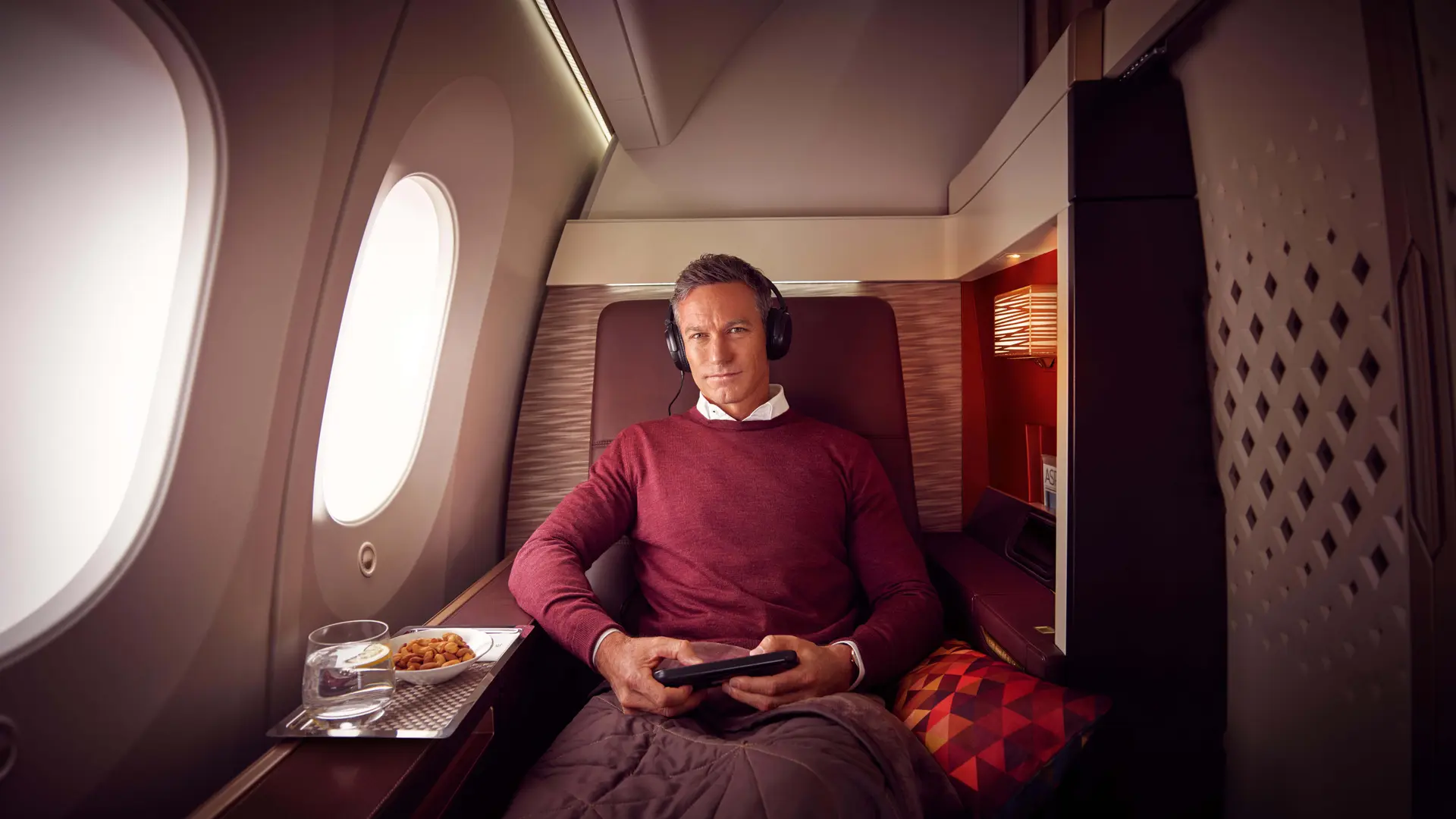 Man relaxing in Etihad First Class