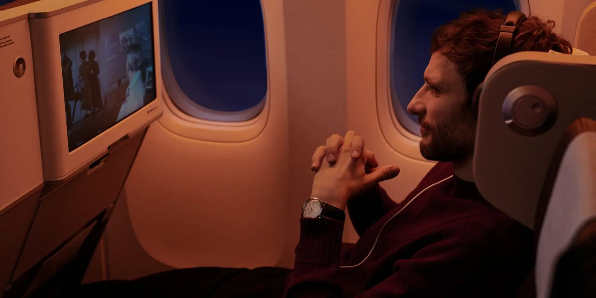 man using in flight entertainment system in SWISS Premium Economy